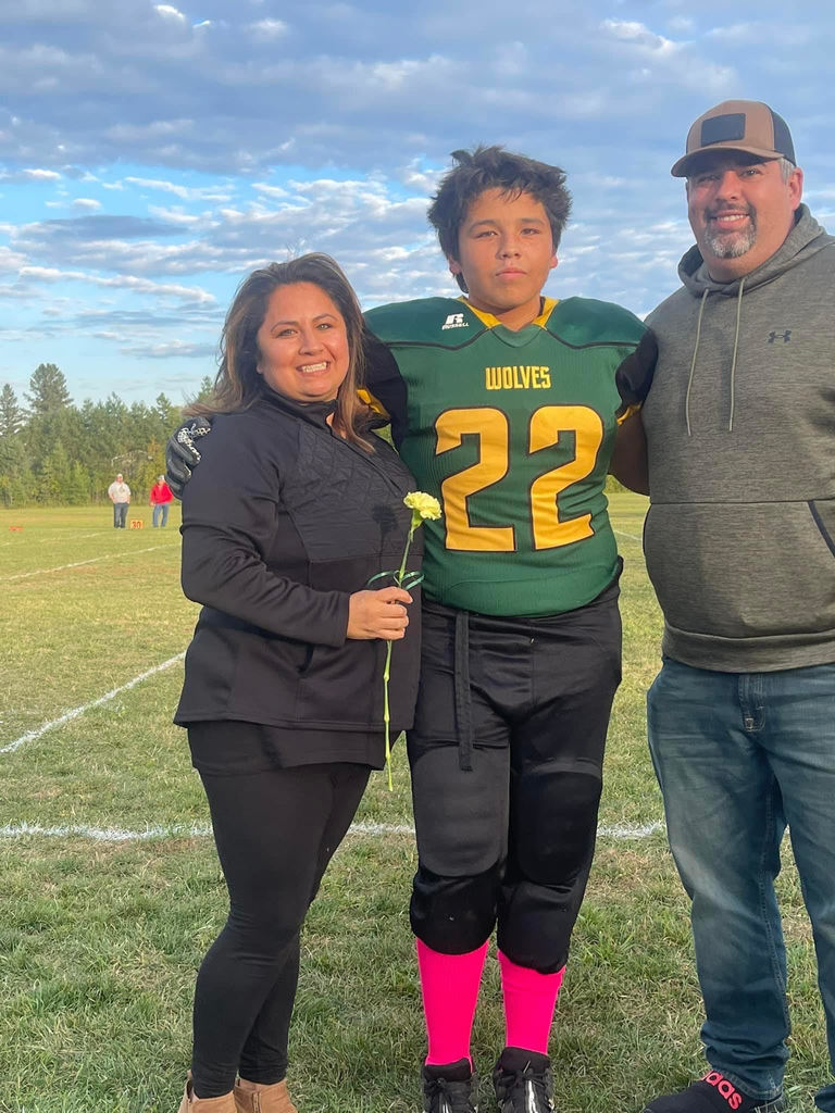 Kche Shawano and parents